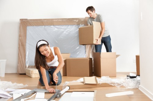 Packed boxes and furniture ready for a house move in Acton