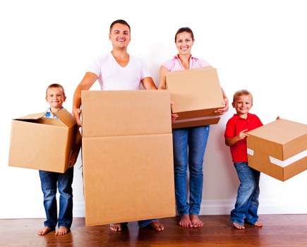 Removal service in Acton with moving van and packed boxes