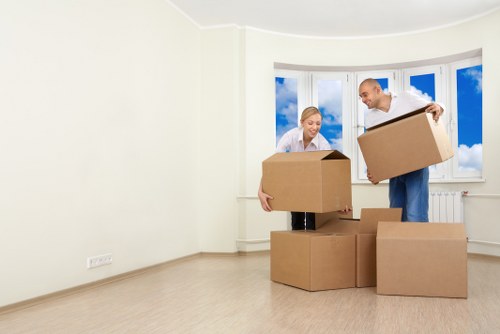 Loading furniture into a removal vehicle for a local Acton relocation