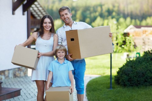 Careful furniture handling during a house move in Acton