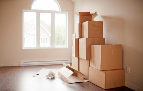 Local movers handling furniture during a home relocation in Acton