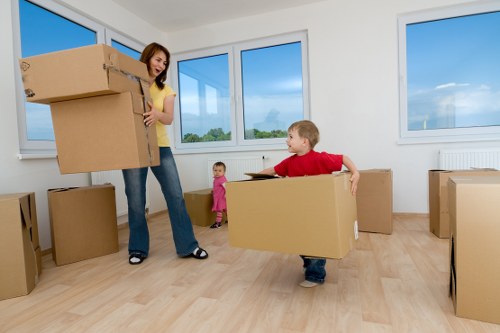 Professional movers planning access for an Acton property