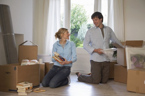 Local Acton moving truck handling furniture and boxes