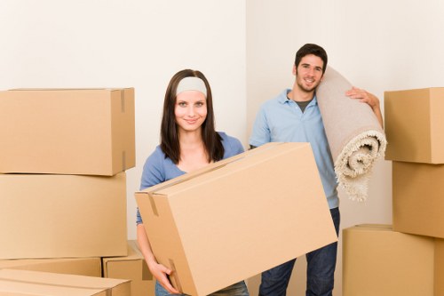 Professional movers handling household items during an Acton relocation