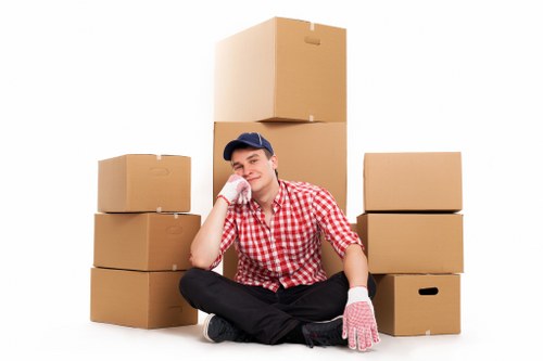 Careful unloading from a removal van at a property in Acton